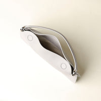Open interior of white Penelope Mini small leather handbag for versatile everyday use