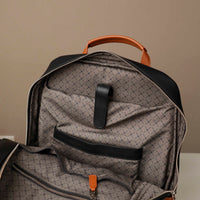 Black backpack with a patterned interior on a neutral background
