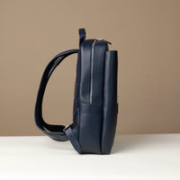 Navy blue backpack on a beige background
