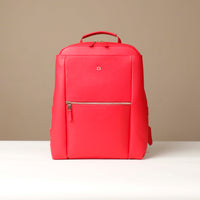 Red backpack on a beige background