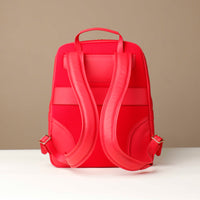 Red backpack on a beige background