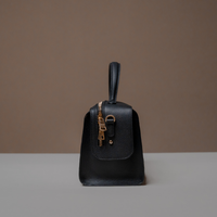 Side View of Black Avela Bag with top handle and detachable strap
