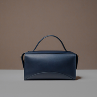 Back View of Blue Avela Bag with top handle and detachable strap