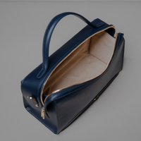Top Open View of Blue Avela Bag with top handle and detachable strap