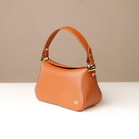 Side view of brown Hold Bag by Danilos in smooth leather