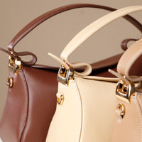 Close up beige and brown Hold Bag by Danilos in smooth leather