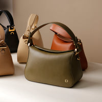Olive green Hold Bag by Danilos in smooth leather with other variants on the background.