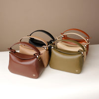 six Satchel hold bag in leather, shown in multiple colors, side profile view