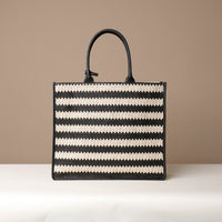 Back View of Raffia Mercatto tote bag, a lightweight, artisanal woven bag crafted from natural raffia.