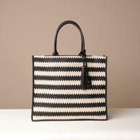 Black Front View of Raffia Mercatto tote bag, a lightweight, artisanal woven bag crafted from natural raffia.
