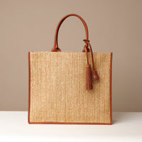 A collection of Raffia Mercatto Tote Bags in various patterns and color combinations, featuring a common design with leather details.