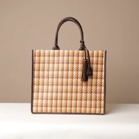 A collection of Raffia Mercatto Tote Bags in various patterns and color combinations, featuring a common design with leather details.