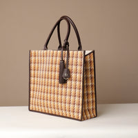 Angled View of Raffia Mercatto tote bag, a lightweight, artisanal woven bag crafted from natural raffia.