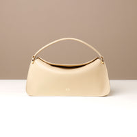 Front view of beige Penelope Mini small leather handbag for versatile everyday use