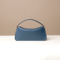 Back view of blue Penelope Mini small leather handbag for versatile everyday use