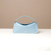 Front view of light blue Penelope Mini small leather handbag for versatile everyday use