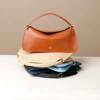 A collection of Penelope Mini small leather handbag for versatile everyday use