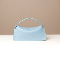 Back view of light blue Penelope Mini small leather handbag for versatile everyday use