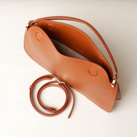 Open interior of brown Penelope Mini small leather handbag for versatile everyday use