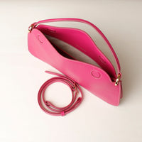 Open interior of pink Penelope Mini small leather handbag for versatile everyday use