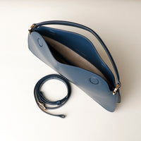 Open interior of blue Penelope Mini small leather handbag for versatile everyday use