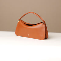 Side view of Brown Penelope Mini small leather handbag for versatile everyday use