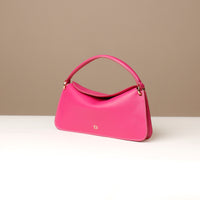 Side view of pink Penelope Mini small leather handbag for versatile everyday use