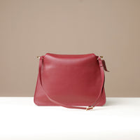 Back of Penelope Sr. red leather shoulder bag – clean silhouette with smooth finish