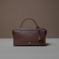 Front View of Brown Avela Bag with top handle and detachable strap