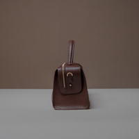 Side View of Brown Avela Bag with top handle and detachable strap