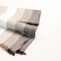 Striped scarf with brown, beige, and gray colors on a white background