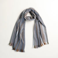 Striped scarf with blue, gray, and beige colors on a white background