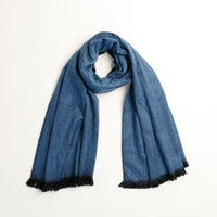 Blue scarf with black trim on a white background