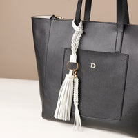 White stylish decorative accessories designed to add personality and flair to bags, keys, or everyday items. Perfect for gifting or styling.