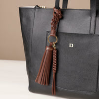 Brown stylish decorative accessories designed to add personality and flair to bags, keys, or everyday items. Perfect for gifting or styling.