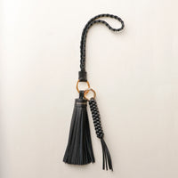 Black stylish decorative accessories designed to add personality and flair to bags, keys, or everyday items. Perfect for gifting or styling.
