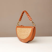 Brown handbag with straw texture on a beige background