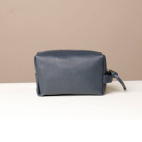 Back view of blue Compact leather dopp kit for men and women by Danilos
