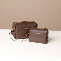 Two brown Compact leather dopp kit for men and women by Danilos