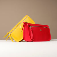 Yellow and red handbags on a beige background