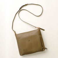 Green shoulder bag on a white background
