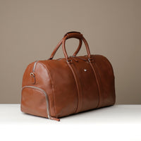 Angled View of Premium leather duffle bag designed for travel with spacious interior, durable construction, and refined details