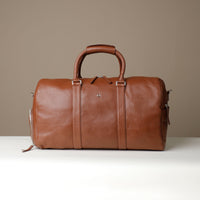 Front View of Premium leather duffle bag designed for travel with spacious interior, durable construction, and refined details