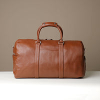 Back View of Premium leather duffle bag designed for travel with spacious interior, durable construction, and refined details
