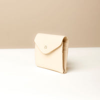 Side view of white Danilo’s compact Anahí Wallet with card slots
