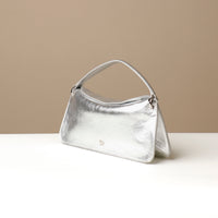 Side view of silver Penelope Mini small leather handbag for versatile everyday use