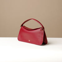 Side view of Red Penelope Mini small leather handbag for versatile everyday use