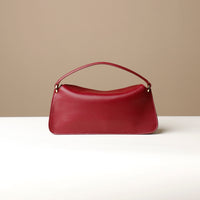Back view of red Penelope Mini small leather handbag for versatile everyday use