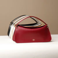 Four Penelope Mini small leather handbag for versatile everyday use