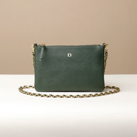 A green leather pouch with a gold chain strap and a gold 'D' emblem on the front.
